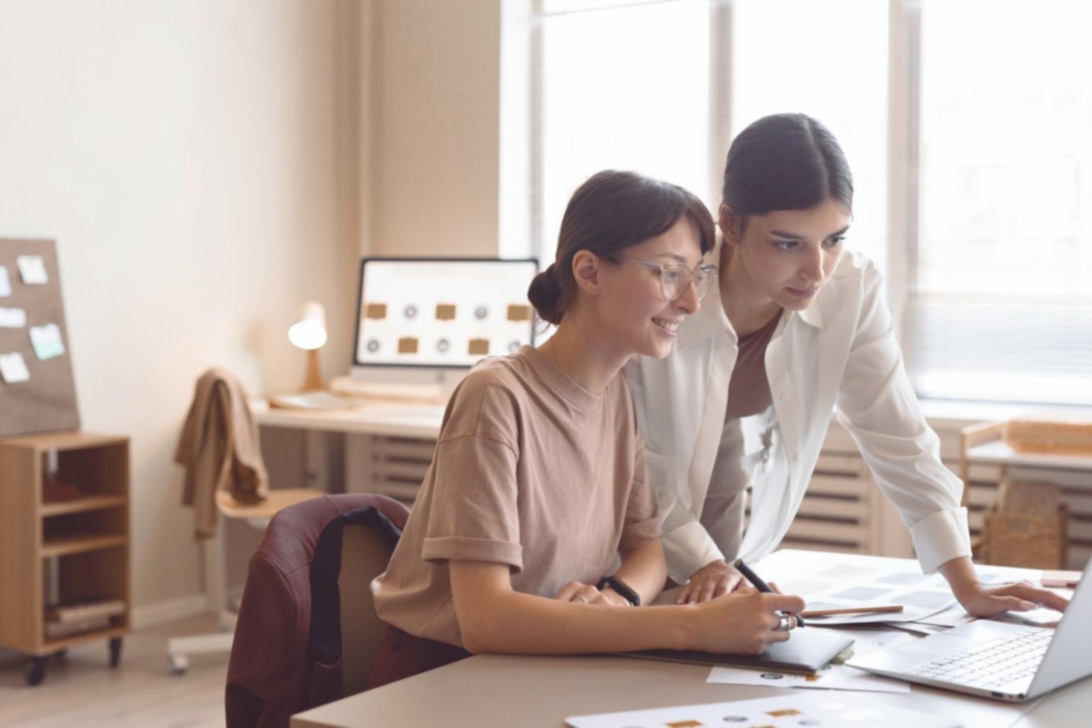 Business owner reviewing financial documents and budget planning materials